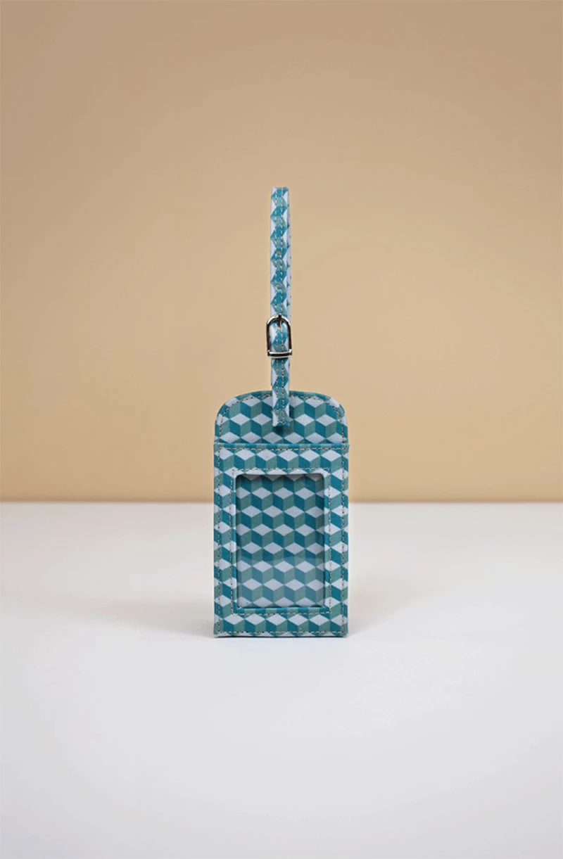 Tag para mala de viagem na cor azul com detalhes em azul claro.